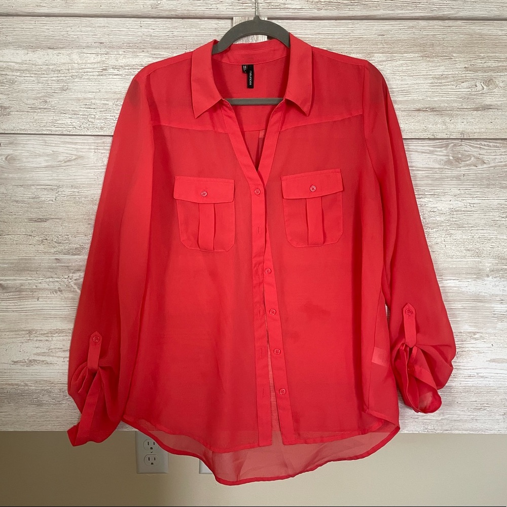 Sheer coral blouse.